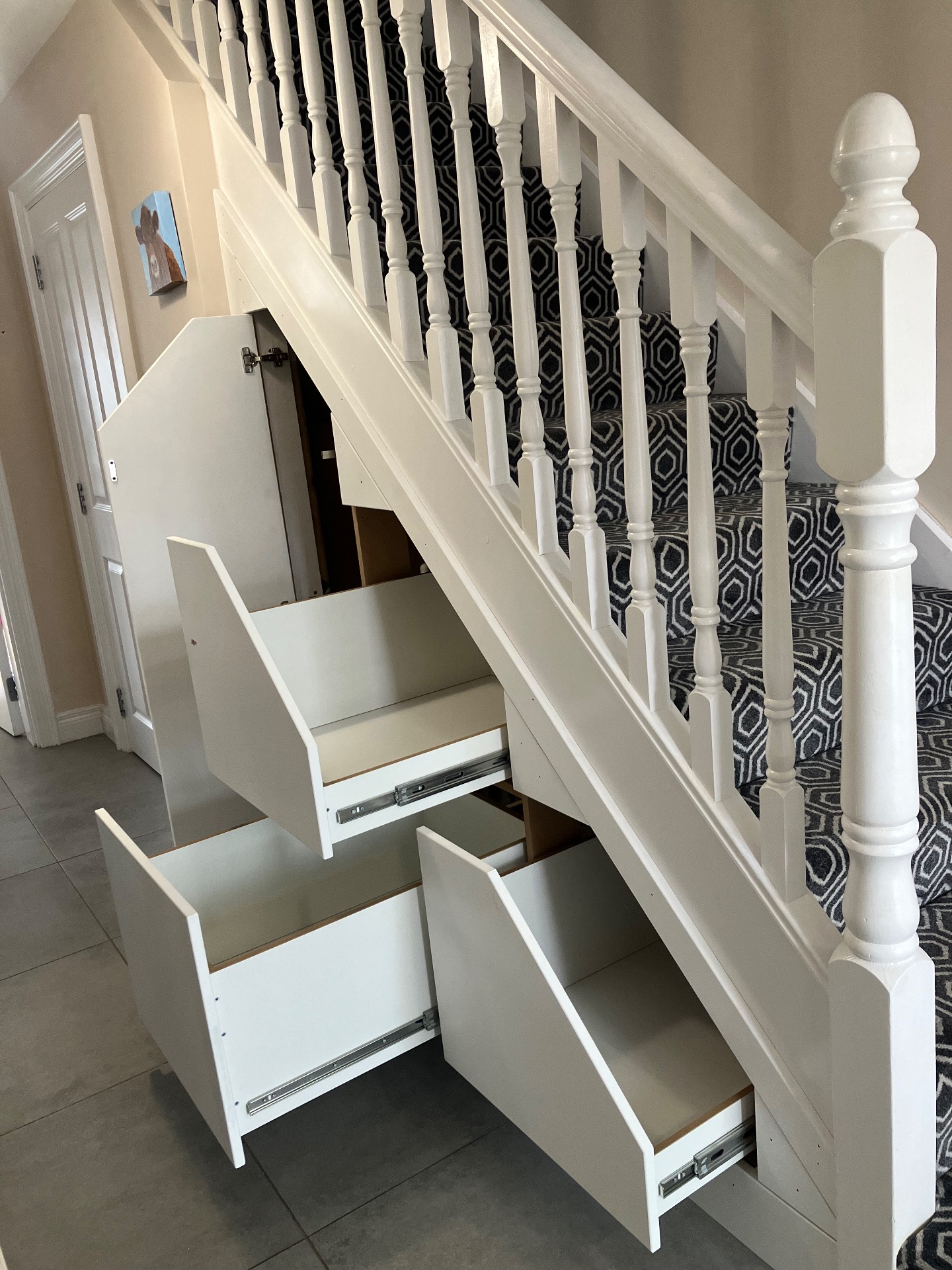 After: This push to open 3 drawer unit was fitted in Antrim town turning an inadequate storage space into stylish practical drawers and door for taller items